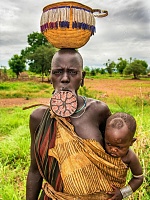 Click image for larger version. 

Name:	african-tribe-mursi-with-big-lip-plate-carrying-her-EW3D1H.jpg 
Views:	30 
Size:	167.3 KB 
ID:	24668